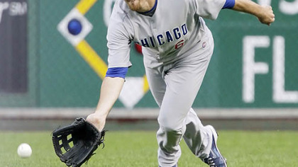 Cubs right fielder Micah Hoffpauir fields a fourth-inning single by Pirates second baseman Freddy Sanchez.