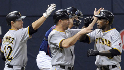 Pirates Freddy Sanchez, left, and Jack Wilson, center, congratulate Nyger Morgan, right, on his two-run home run off Minnesota's Glen Perkins in the third inning.