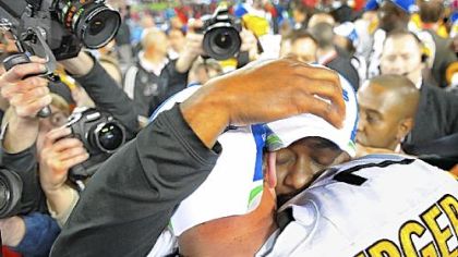 Coach Mike Tomlin sheds a tear while hugging quarterback Ben Roethlisberger.