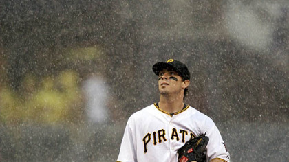 Pirates third baseman Andy LaRoche stands in the rain during yesterday's game.