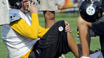 Quarterback Ben Roethlisberger is attended to by trainers near the end of practice August 20, 2009. Roethlisberger injured his right foot when tackle Max Starks fell on him during pass drills near the end of practice.