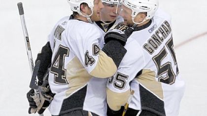 Brooks Orpik, Sidney Crosby and Sergei Gonchar celebrate Gonchar's series-clinching goal against the Flyers Saturday in Philadelphia.