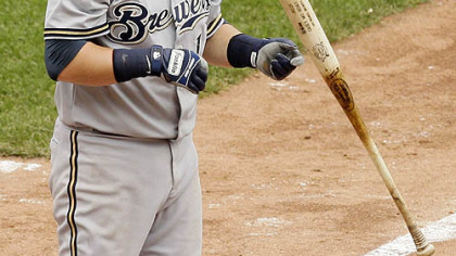 Brewers infielder Casey McGehee flips his bat after striking out with men on first and third during the ninth inning.