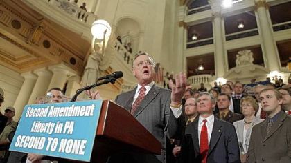 John Sigler, president of the National Rifle Association address the crowd during a gun rights rally in the Capitol rotunda yesterday.