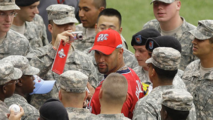 Cardinals Albert Pujols of the St. Louis Cardinals signs autographs for military personnel before the game.