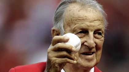 Former Cardinals first baseman and Donora native Stan Musial holds up the ceremonial first pitch ball.