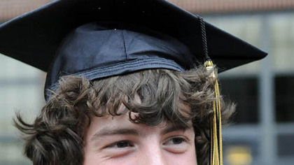Pictured, from top: Alex Myers peeks over a chair during a Sunday night visit to Children's Hospital emergency room, 1998. 
Alex after graduating from Riverview High School in Oakmont on June 11.
