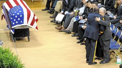 Pittsburgh police Chief Nate Harper embraces Paul Sciullo, father of slain Officer Paul J. Sciullo II.