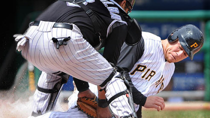 Brandon Moss is tagged out at home by the Rockies' Yorvit Torrealba in yesterday's fifth inning at PNC Park.