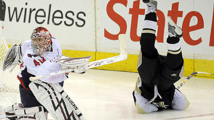 Chris Kunitz goes flying behind Capitals' goaltender Simeon Varlamov in overtime of game 6 of the second round of the Stanley Cup Playoffs at Mellon Arena Monday.