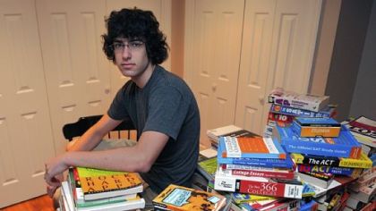 Hunter Berk, 16, a junior at Fox Chapel Area High School, has collected piles of SAT books to donate to students who will be studying for the test.