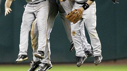 Pirates shortstop Jack Wilson (2), second baseman Ramon Vazquez (5) and outfielders Brandon Moss, right, Andrew McCutchen (22) and Garrett Jones celebrate after beating the Astros, 6-3, last night.