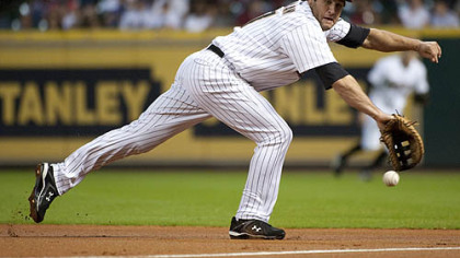Astros first baseman Lance Berkman tries to reach a ball hit by Pittsburgh Pirates first baseman/outfielder Garrett Jones during the first inning. Jones reached second with a double.