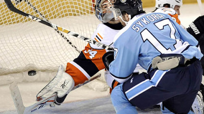 Petr Sykora snaps the only goal of the night past Islanders goalie Yann Danis with less than three minutes to play last night at Mellon Arena.