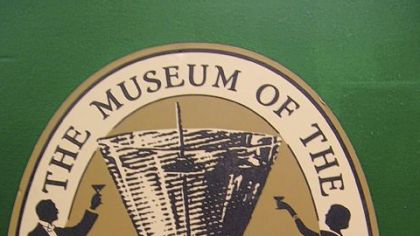 The logo of The Museum of the American Cocktail in New Orleans.