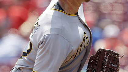 Pirates pitcher Zach Duke throws against the Reds during the sixth inning.