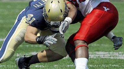 Andrew Taglianetti stops Youngstown State's Josh Lee in Pitt's season opener. He tore his ACL against Buffalo on Saturday.