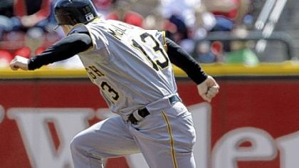 Nate McLouth avoids a batted ball hit by Ryan Doumit in the third inning yesterday in Cincinnati. McLouth had a big day with two hits, two runs scored and three RBIs.