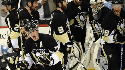 Evgeni Malkin celebrates as he leaves the ice after teammate Kris Letang shot the winning goal in overtime against the Capitals in Game 3 of the second round of the Stanley Cup Playoffs last night.