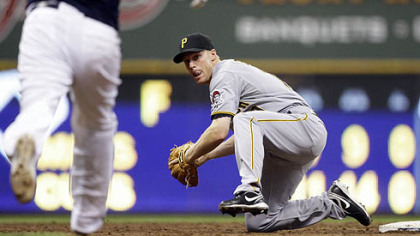 Brian Bixler looks to throw around Brewers' Yovani Gallardo to try and turn a double play on a ball hit by Felipe Lopez. Lopez beat the throw to first.