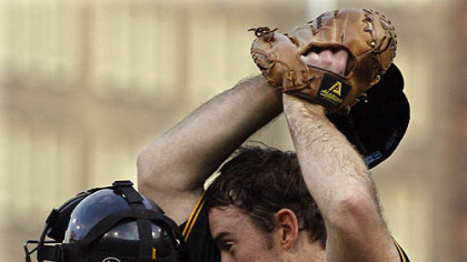 Ross Ohlendorf, right, wipes his head as he talks with catcher Jason Jaramillo after the Astros scored their first run in the second inning of yesterday's baseball game.