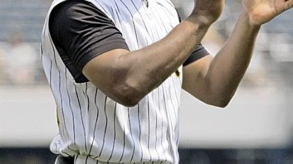 Tony Beasley returned to the Pirates' third-base coaching box yesterday against the St. Louis Cardinals after the death of his father and aunt.