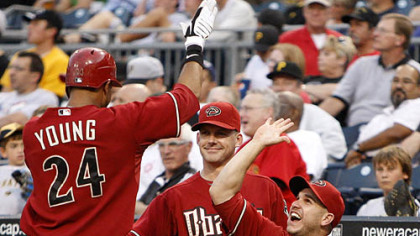Diamondbacks outfielder Chris Young is greeted by manger A.J. Hinch, center, and teammates after hitting a two-run home run off Pirates pitcher Zach Duke in the fourth inning.