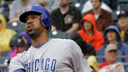 Cubs first baseman Derrek Lee follows through on a two-run homerun off Pirates pitcher Daniel McCutchen during the third inning.