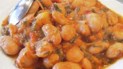 A platter of gigantes plaki, a Greek bean dish served in tavernas all over the country. This version is from Sterna of Bloumosifis in Vamos, a small town on the island of Crete.