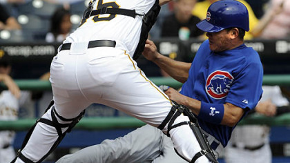 Cubs outfielder Kosuke Fukudome slides safely into home against Pirates catcher Jason Jaramillo in the first inning.