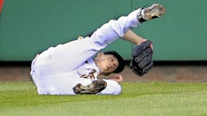 Pirates outfielder Jeff Salazar makes a diving grab on a ball hit by Diamondbacks outfielder Gerardo Parra in the fifth inning.