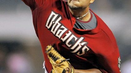 Diamondbacks pitcher Yusmeiro Petit pitches against the Pirates.