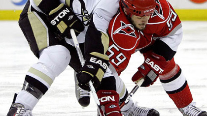 Former Penguins defenseman Rob Scuderi, battling with Hurricanes forward Chad LaRose during Game 3 of the Eastern Conference final last season, signed with the Kings yesterday.