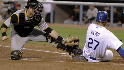 Pirates catcher Ryan Doumit tags out Dodgers outfielder Matt Kemp at home on a double by outfielder Manny Ramirez.
