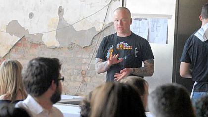 Chef Kevin Sousa describes his next course to his guests.