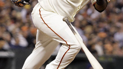Giants third baseman Pablo Sandoval runs to first base after hitting a single off Pirates pitcher Paul Maholm during the fifth inning.