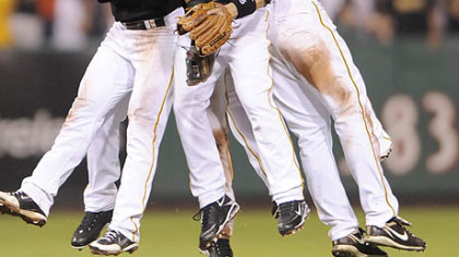 Pirates shortstop Ronny Cedeno, outfielder Lastings Milledge, second baseman Ramon Vazquez and outfielders Garrett Jones and Andrew McCutchen celebrate their win against the Nationals last night.