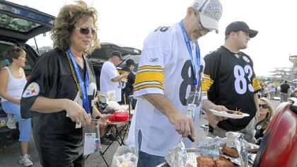 Dave and son David Hall go for a first down == or is it a third? == at a pre-season tailgate.