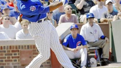 The Cubs' Derrek Lee hits a two-run double off Pirates starter Charlie Morton in the second inning yesterday at Wrigley Field in Chicago. Lee had seven RBIs before he was given the rest of the game off after the fourth inning.