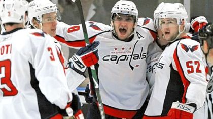 The Capitals' Alex Ovechkin, center, celebrates with teammates after scoring in the second period against the Rangers yesterday at Madison Square Garden in New York. The Capitals went on to win and force a Game 7 in Washington in the first-round NHL playoffs series.