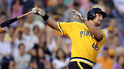 Pirates' Garrett Jones hits a three-run home run against the Reds in the third inning tonight at PNC Park.