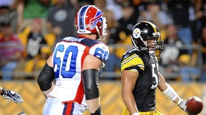 Linebacker James Farrior runs in to the end zone with a first-half interception from Bills quarterback Trent Edwards last night at Heinz Field.
