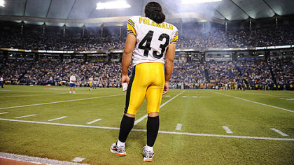 Steelers safety Troy Polamalu watches from the sidelines against the Vikings at the Hubert Humphrey Stadium in Minneapolis in August. He is often seen crossing himself -- right to left -- during games.