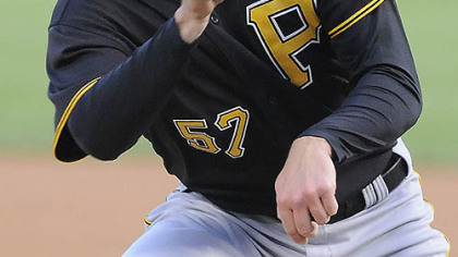Zach Duke nearly gets hit by Chicago White Sox's Scott Podsednik's single during the first inning of last night's baseball game  in Chicago.