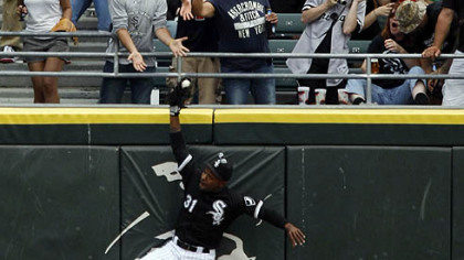 White Sox center fielder DeWayne Wise makes a leaping catch of a ball hit by Rays outfielder Gabe Kapler during the ninth inning of a 5-0 win yesterday in Chicago. The catch helped secure a perfect game for pitcher Mark Buehrle.
