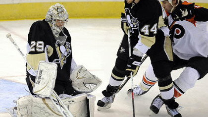 Brooks Orpik helps defend the goal Marc-Andre Fleury makes a save on Flyers Mike Knuble in the second period.