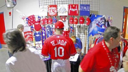 Astros shortstop Miguel Tejada buys souvenirs before the game.