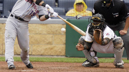 Mets outfielder Ryan Church, connects with a pitch from Pirates pitcher Matt Capps in the 10th inning yesterday.