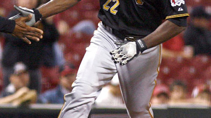 Pirates outfielder Andrew McCutchen rounds the bases after hitting a solo home run off Reds pitcher Johnny Cueto in the sixth inning during the second game of a doubleheader yesterday in Cincinnati. The Reds won 6-3.