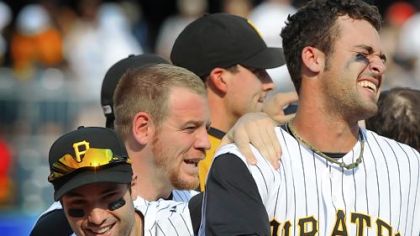 Garrett Jones, right, celebrates with teammates after his hit in the bottom of the ninth beat the Cardinals, 6-5.